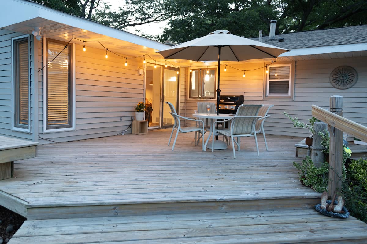Covered patio dining area with umbrella